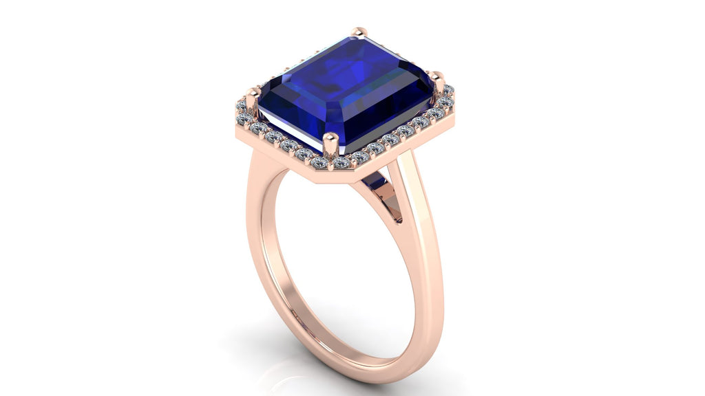 Anillo con zafiro central corte esmeralda y halo de diamantes - Fernanda