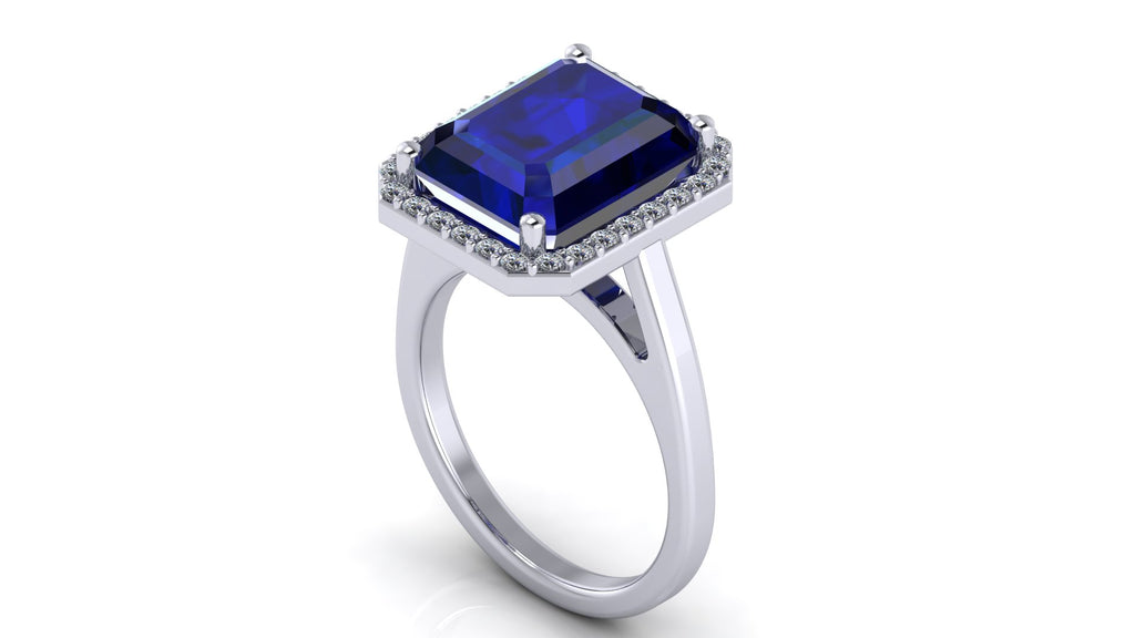 Anillo con zafiro central corte esmeralda y halo de diamantes - Fernanda